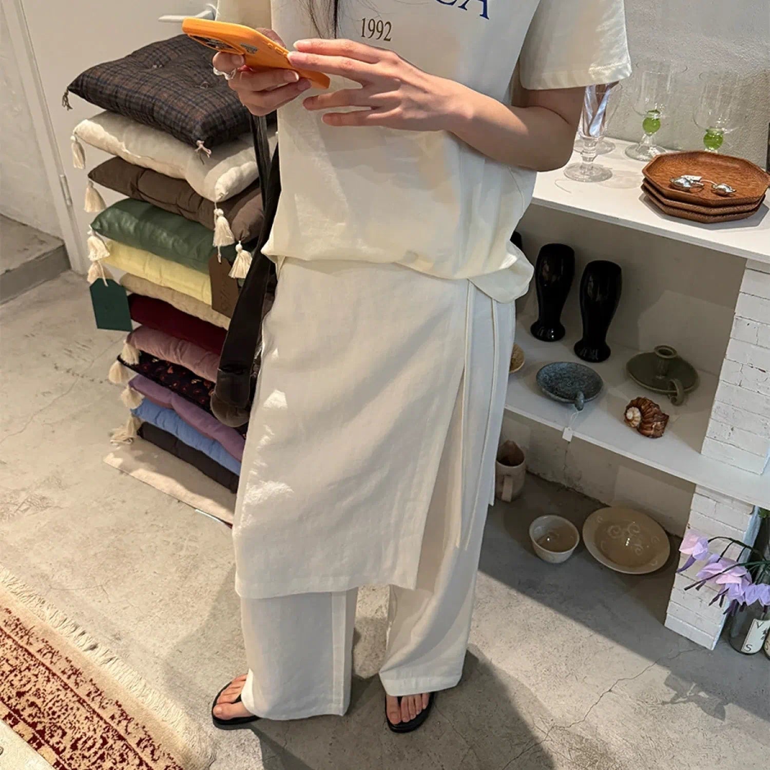 “Osaka” layered wrap pants with side tie detail, minimalist Japandi-inspired design, wide-leg silhouette, product by Sumoka Studio.