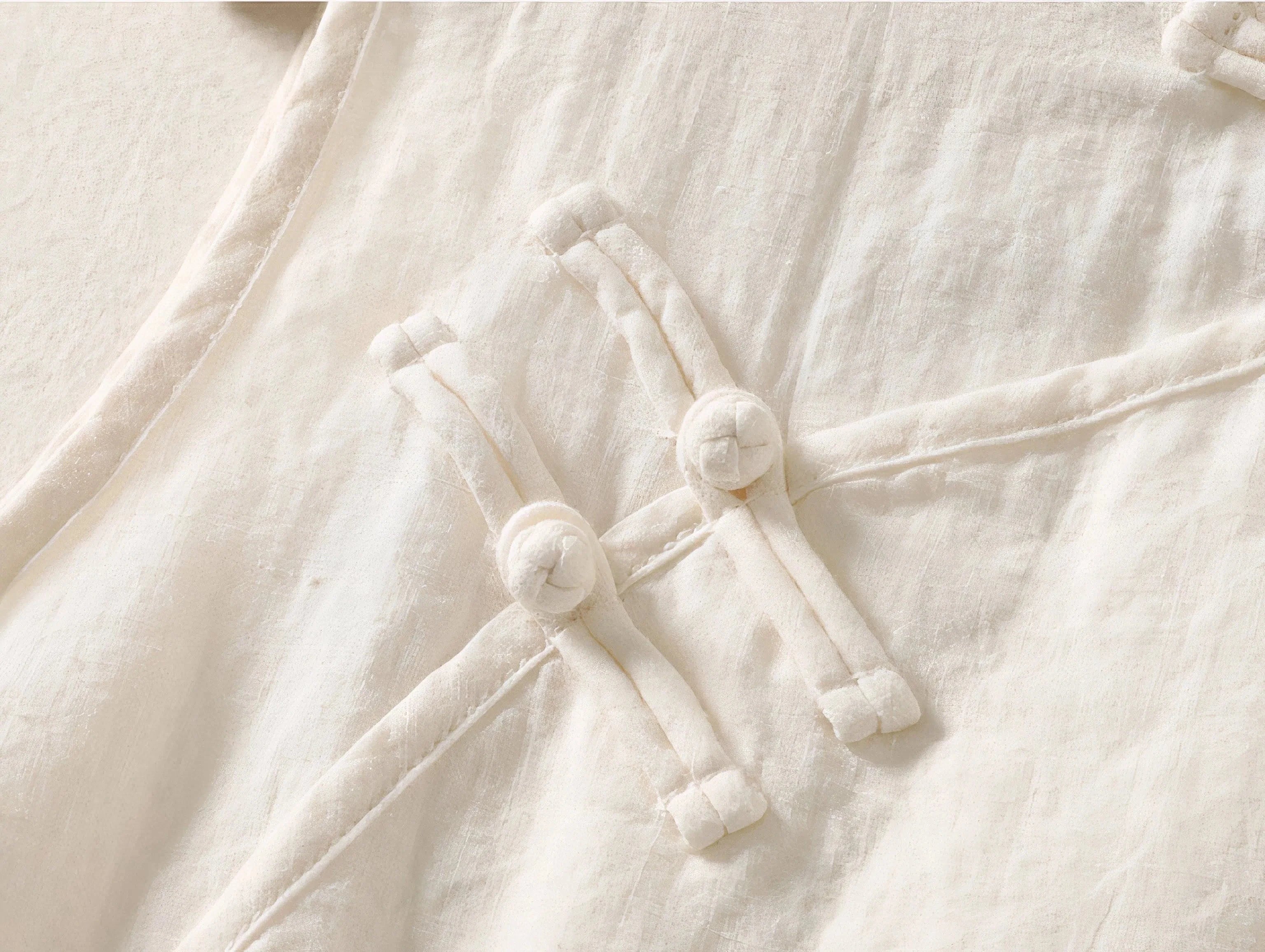 Top Sora minimalist Japandi-style top worn by a woman, asymmetrical design, product by Sumoka Studio.