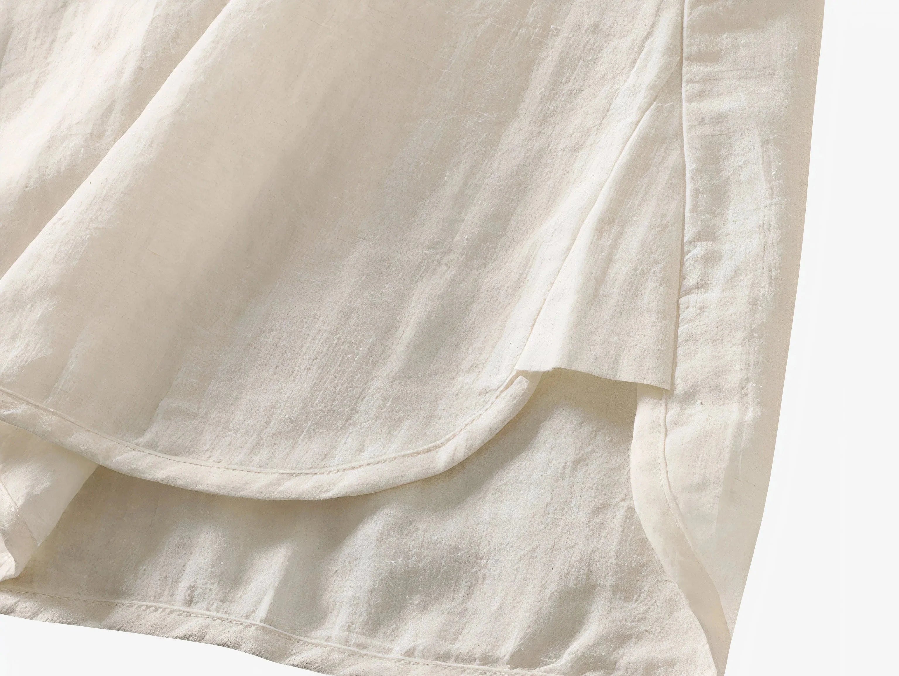 Top Sora minimalist Japandi-style top worn by a woman, asymmetrical design, product by Sumoka Studio.