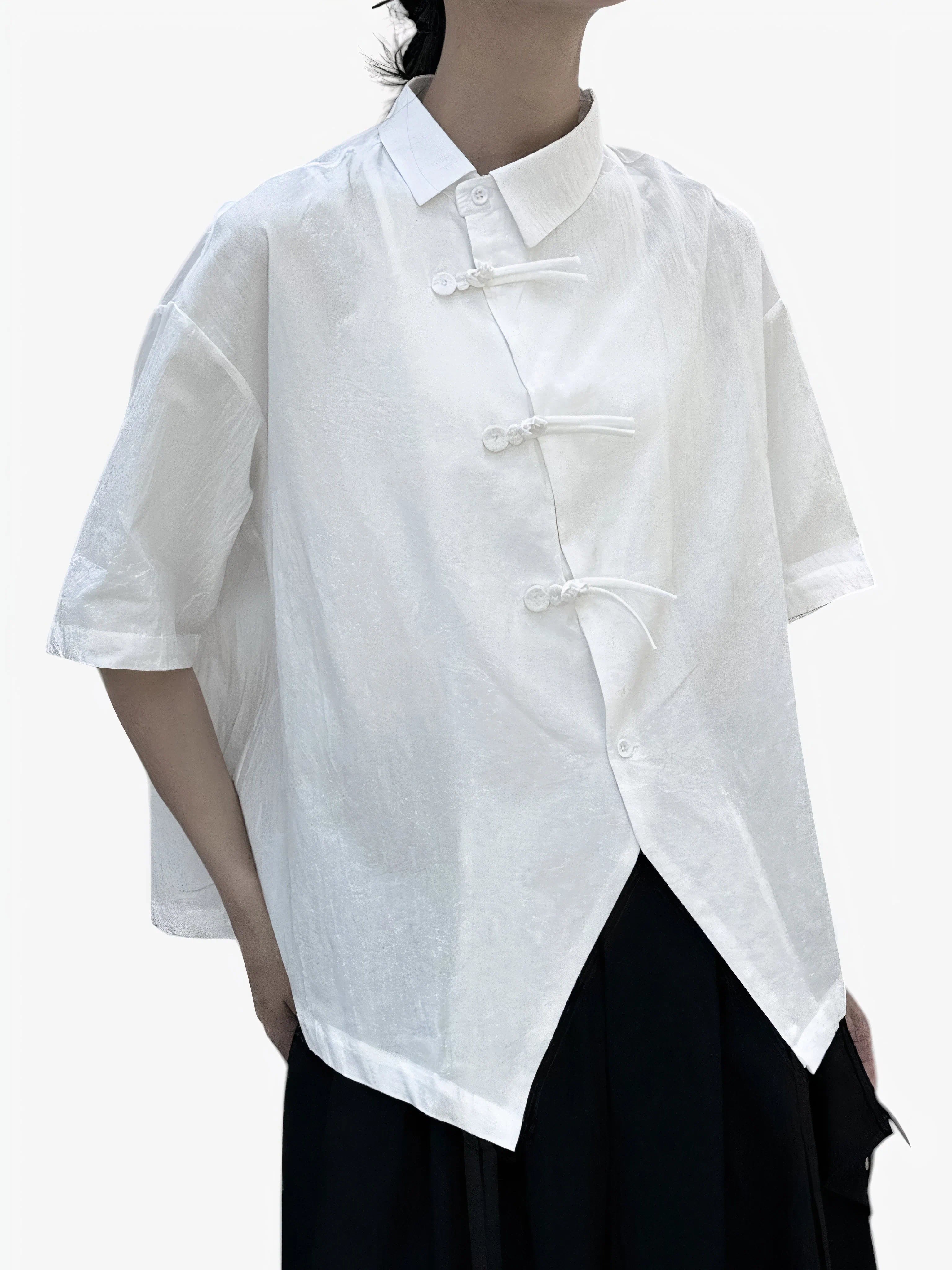 “Koto” white short-sleeve asymmetric shirt with traditional knot closures, minimalist Japandi aesthetic, lightweight texture, product by Sumoka Studio.